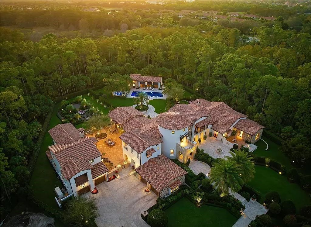 Crafted by London Bay Homes, this 5-bedroom, 8-bathroom masterpiece spans 11,408 square feet on a 1.78-acre lot within the prestigious Mediterra community.