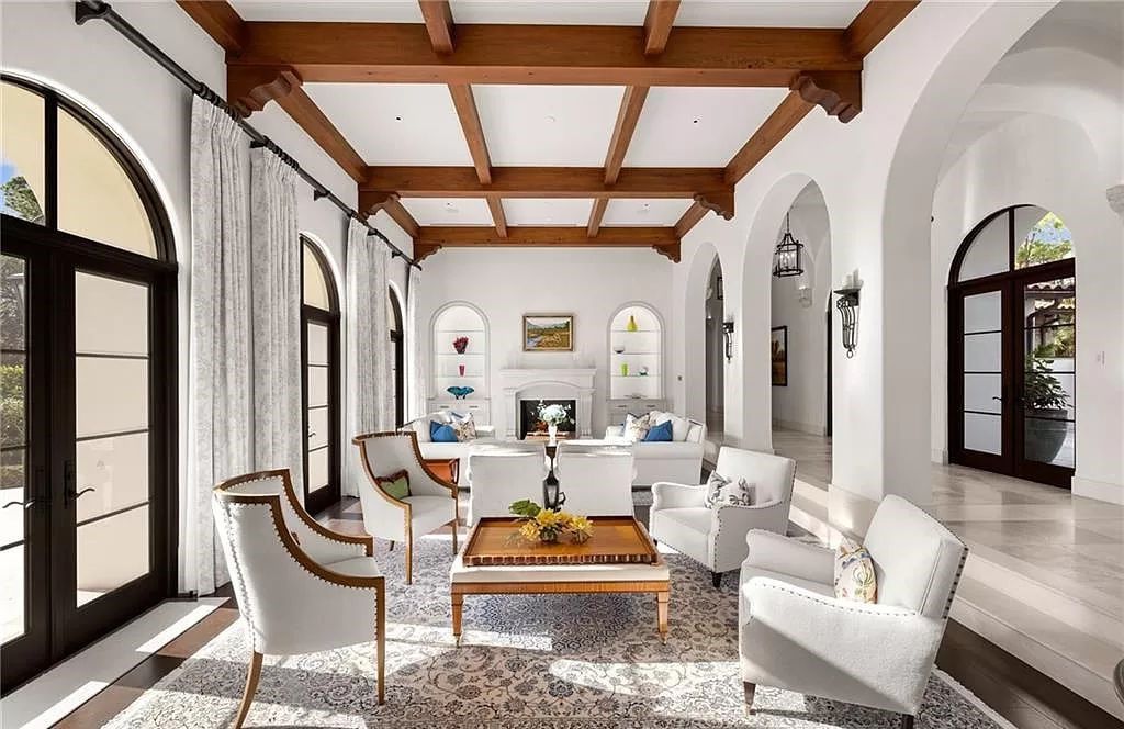 Crafted by London Bay Homes, this 5-bedroom, 8-bathroom masterpiece spans 11,408 square feet on a 1.78-acre lot within the prestigious Mediterra community.