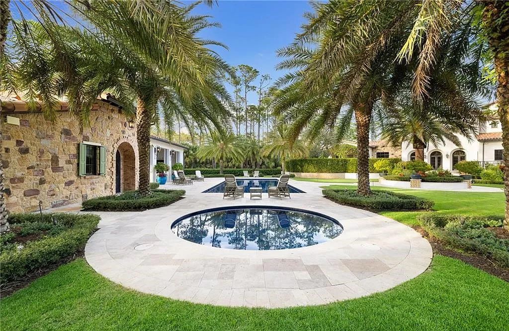 Crafted by London Bay Homes, this 5-bedroom, 8-bathroom masterpiece spans 11,408 square feet on a 1.78-acre lot within the prestigious Mediterra community.