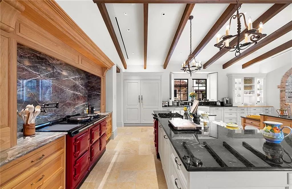 Crafted by London Bay Homes, this 5-bedroom, 8-bathroom masterpiece spans 11,408 square feet on a 1.78-acre lot within the prestigious Mediterra community.