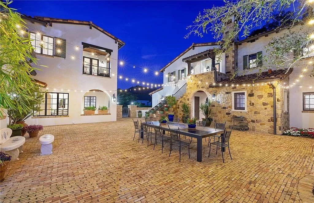 Crafted by London Bay Homes, this 5-bedroom, 8-bathroom masterpiece spans 11,408 square feet on a 1.78-acre lot within the prestigious Mediterra community.