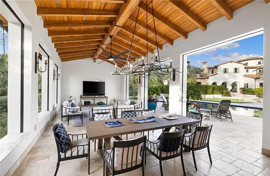 Crafted by London Bay Homes, this 5-bedroom, 8-bathroom masterpiece spans 11,408 square feet on a 1.78-acre lot within the prestigious Mediterra community.