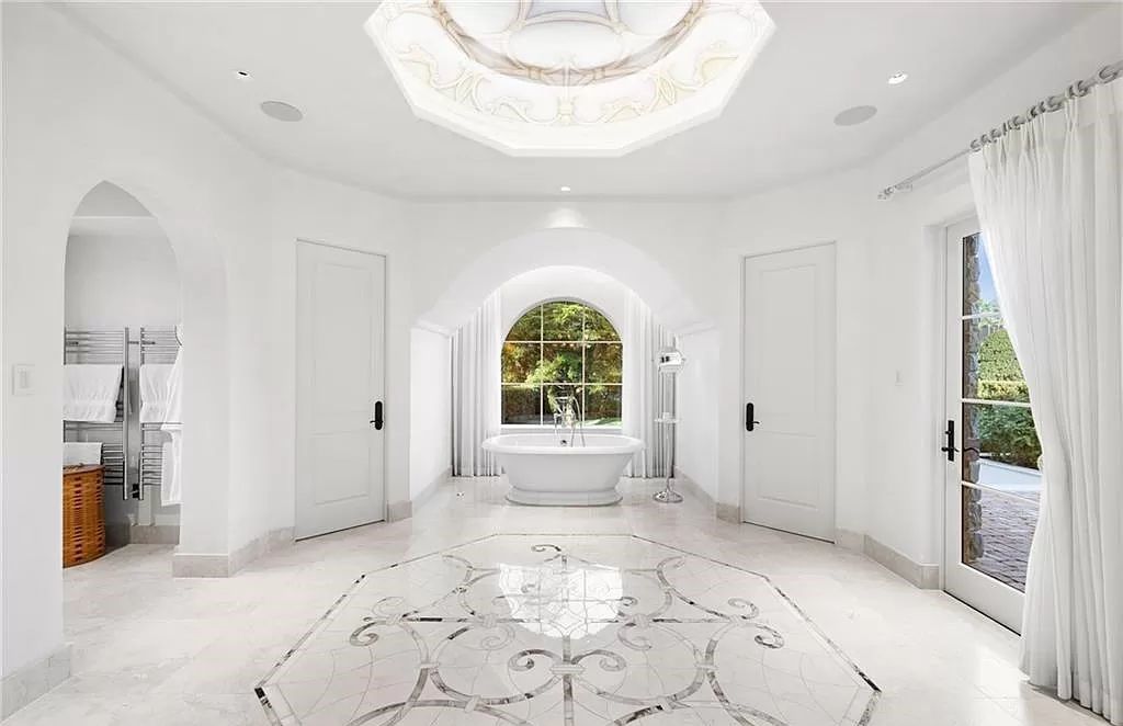 Crafted by London Bay Homes, this 5-bedroom, 8-bathroom masterpiece spans 11,408 square feet on a 1.78-acre lot within the prestigious Mediterra community.