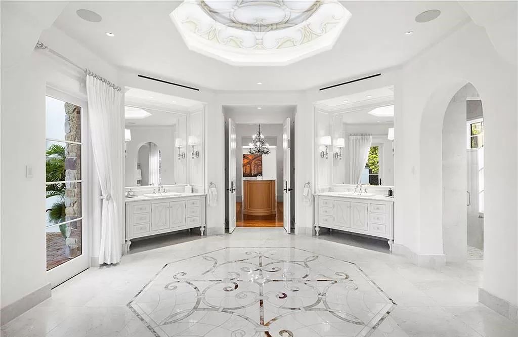 Crafted by London Bay Homes, this 5-bedroom, 8-bathroom masterpiece spans 11,408 square feet on a 1.78-acre lot within the prestigious Mediterra community.