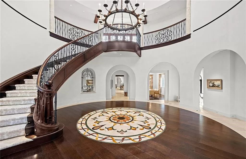 Crafted by London Bay Homes, this 5-bedroom, 8-bathroom masterpiece spans 11,408 square feet on a 1.78-acre lot within the prestigious Mediterra community.