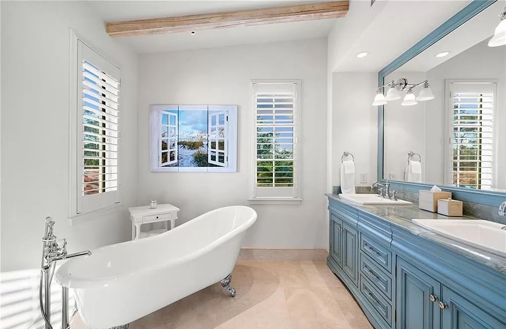 Crafted by London Bay Homes, this 5-bedroom, 8-bathroom masterpiece spans 11,408 square feet on a 1.78-acre lot within the prestigious Mediterra community.