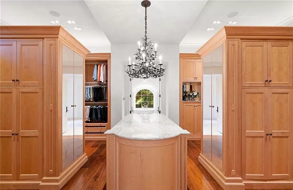 Crafted by London Bay Homes, this 5-bedroom, 8-bathroom masterpiece spans 11,408 square feet on a 1.78-acre lot within the prestigious Mediterra community.