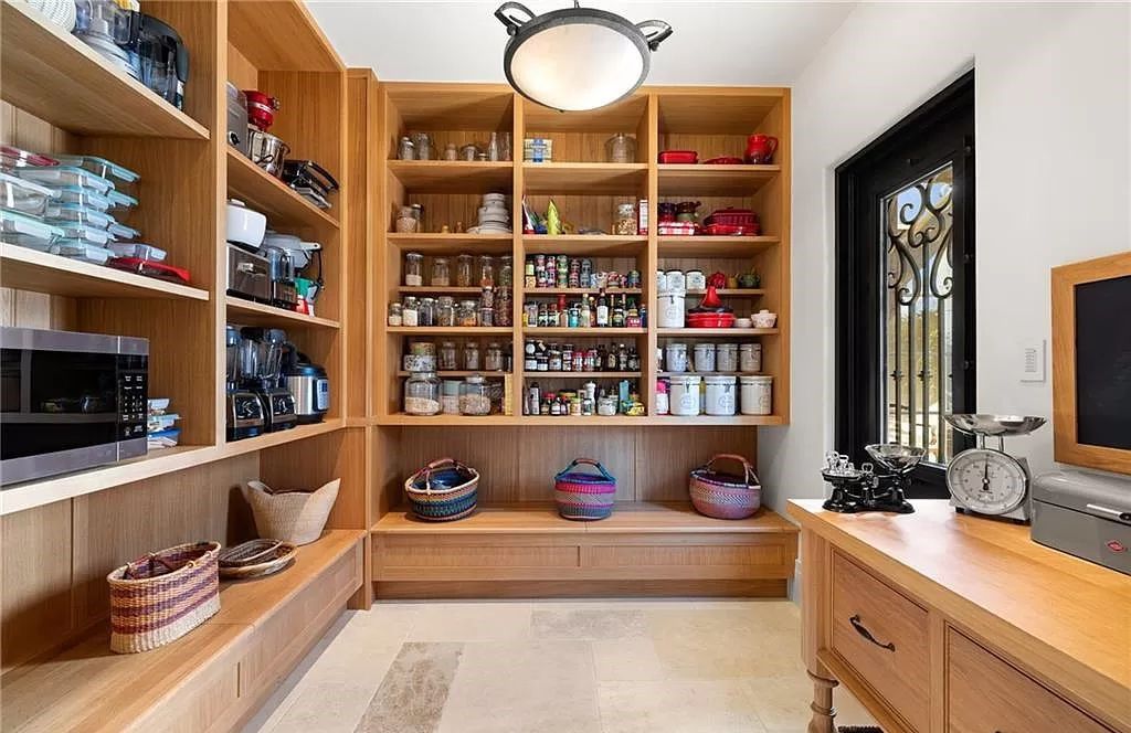 Crafted by London Bay Homes, this 5-bedroom, 8-bathroom masterpiece spans 11,408 square feet on a 1.78-acre lot within the prestigious Mediterra community.