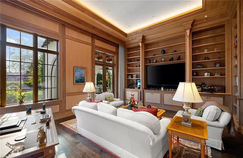 Crafted by London Bay Homes, this 5-bedroom, 8-bathroom masterpiece spans 11,408 square feet on a 1.78-acre lot within the prestigious Mediterra community.