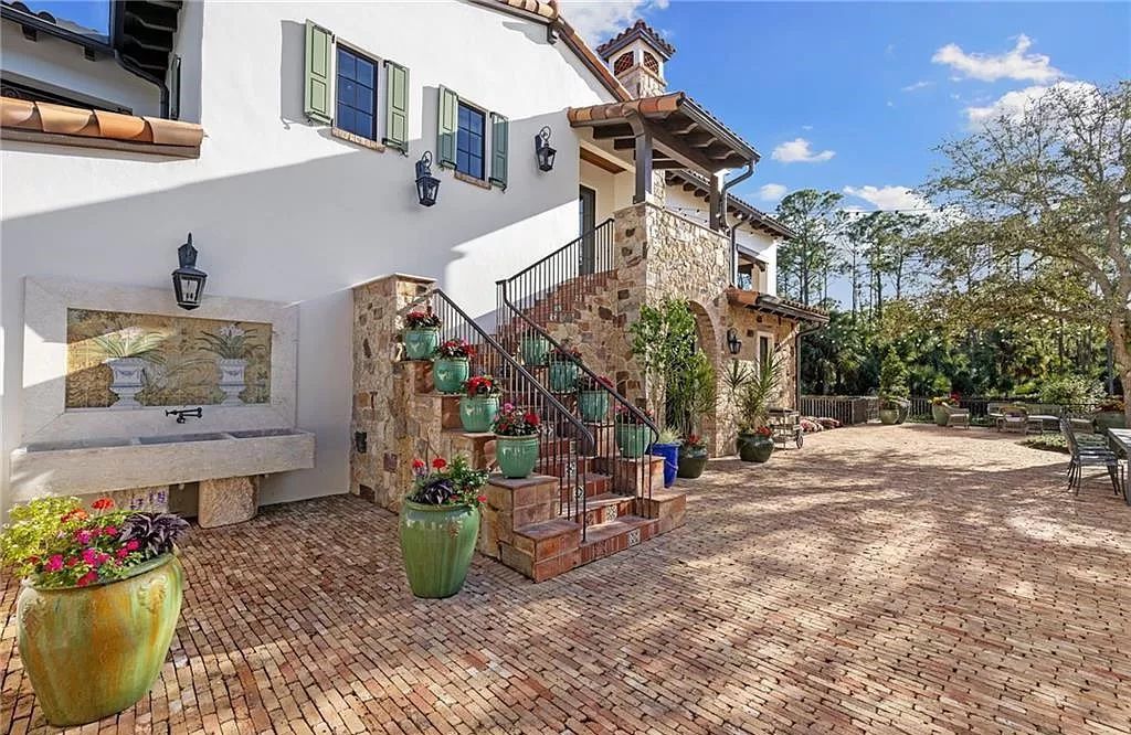 Crafted by London Bay Homes, this 5-bedroom, 8-bathroom masterpiece spans 11,408 square feet on a 1.78-acre lot within the prestigious Mediterra community.