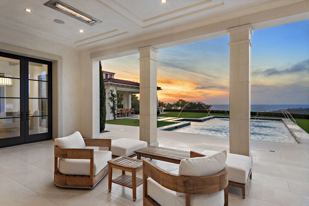 21 Spinnaker Home in Newport Coast, California. Discover luxury living at its finest in this stunning 11,700 sq. ft. estate in Crystal Cove. Completed in 2020, this meticulously designed residence offers unobstructed ocean and coastline views, dual master suites, a chef's kitchen, home theater, gym, and more. 