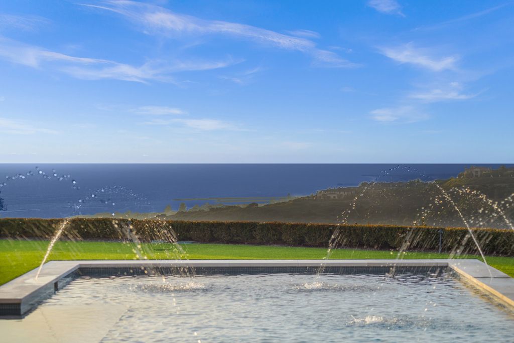 21 Spinnaker Home in Newport Coast, California. Discover luxury living at its finest in this stunning 11,700 sq. ft. estate in Crystal Cove. Completed in 2020, this meticulously designed residence offers unobstructed ocean and coastline views, dual master suites, a chef's kitchen, home theater, gym, and more. 