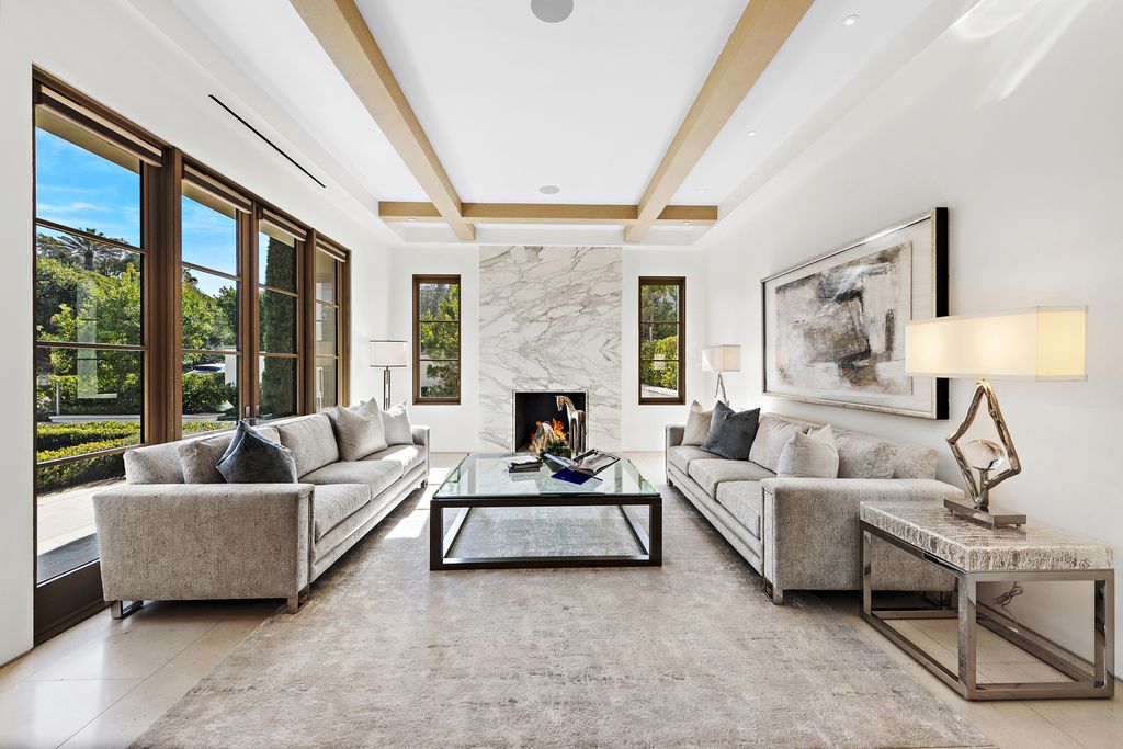 21 Spinnaker Home in Newport Coast, California. Discover luxury living at its finest in this stunning 11,700 sq. ft. estate in Crystal Cove. Completed in 2020, this meticulously designed residence offers unobstructed ocean and coastline views, dual master suites, a chef's kitchen, home theater, gym, and more. 