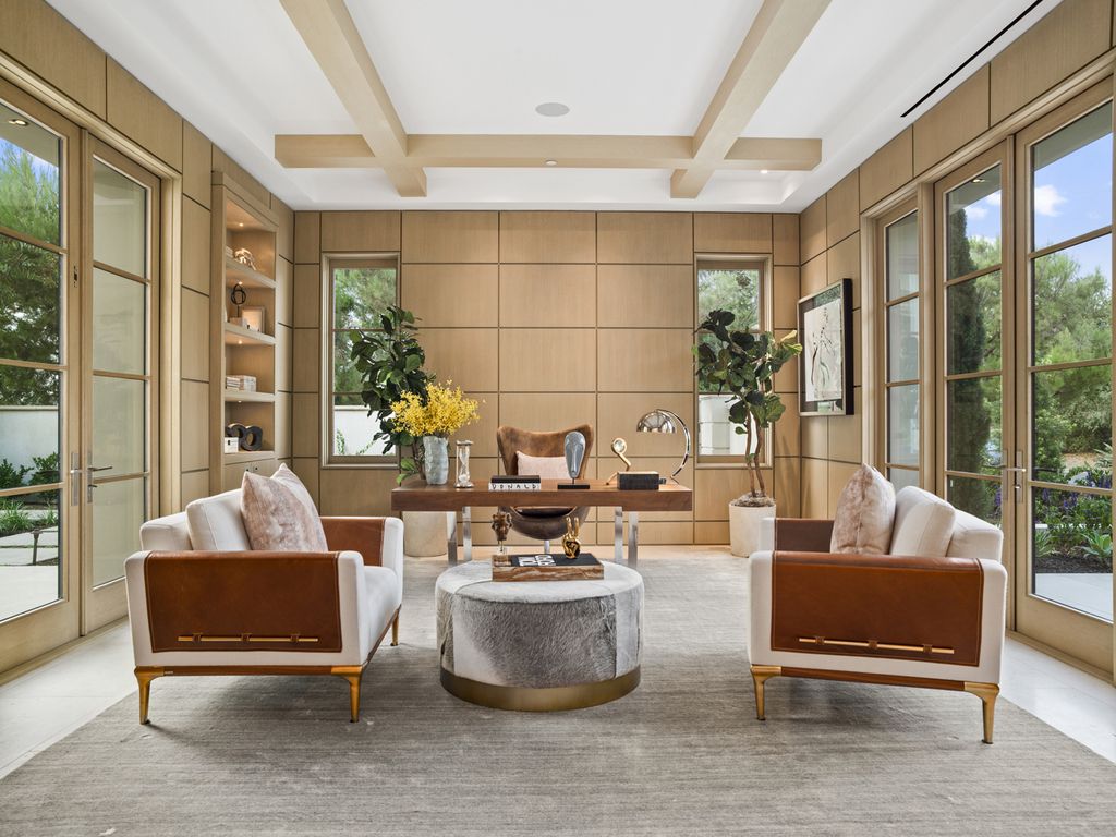 21 Spinnaker Home in Newport Coast, California. Discover luxury living at its finest in this stunning 11,700 sq. ft. estate in Crystal Cove. Completed in 2020, this meticulously designed residence offers unobstructed ocean and coastline views, dual master suites, a chef's kitchen, home theater, gym, and more. 