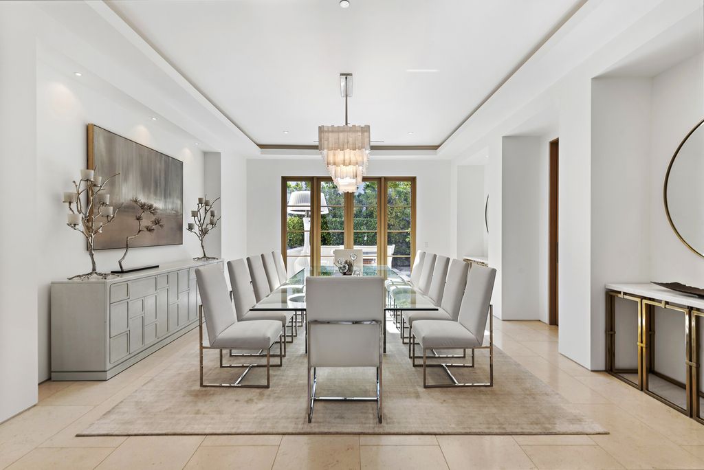 21 Spinnaker Home in Newport Coast, California. Discover luxury living at its finest in this stunning 11,700 sq. ft. estate in Crystal Cove. Completed in 2020, this meticulously designed residence offers unobstructed ocean and coastline views, dual master suites, a chef's kitchen, home theater, gym, and more. 