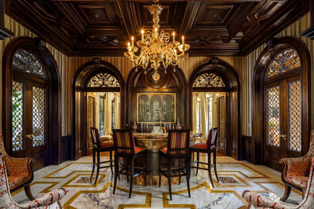 38 Beverly Park Circle Home in Beverly Hills, California. Explore the enchanting Tuscan Villa in the prestigious guard-gated enclave of Beverly Park. This Robert Sinclair masterpiece offers 5 bedrooms, 11 bathrooms, and a host of luxurious features. Nestled on nearly 3 acres, the property boasts mature trees, fountains, and serene walkways.