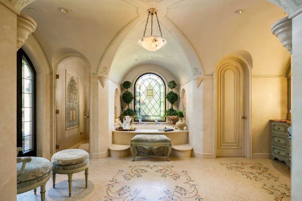 38 Beverly Park Circle Home in Beverly Hills, California. Explore the enchanting Tuscan Villa in the prestigious guard-gated enclave of Beverly Park. This Robert Sinclair masterpiece offers 5 bedrooms, 11 bathrooms, and a host of luxurious features. Nestled on nearly 3 acres, the property boasts mature trees, fountains, and serene walkways.
