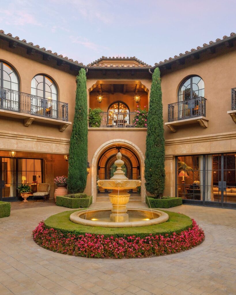 38 Beverly Park Circle Home in Beverly Hills, California. Explore the enchanting Tuscan Villa in the prestigious guard-gated enclave of Beverly Park. This Robert Sinclair masterpiece offers 5 bedrooms, 11 bathrooms, and a host of luxurious features. Nestled on nearly 3 acres, the property boasts mature trees, fountains, and serene walkways.