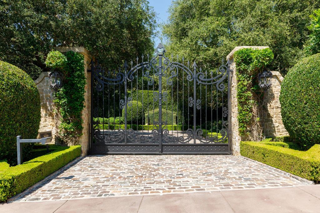 38 Beverly Park Circle Home in Beverly Hills, California. Explore the enchanting Tuscan Villa in the prestigious guard-gated enclave of Beverly Park. This Robert Sinclair masterpiece offers 5 bedrooms, 11 bathrooms, and a host of luxurious features. Nestled on nearly 3 acres, the property boasts mature trees, fountains, and serene walkways.