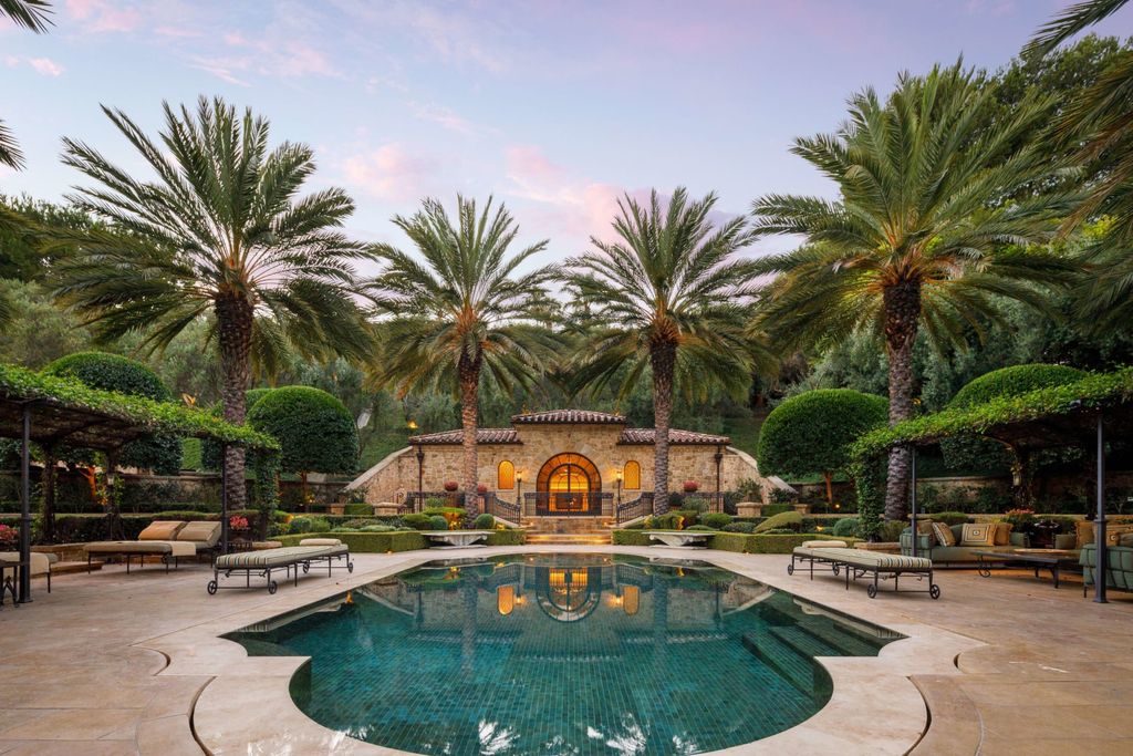 38 Beverly Park Circle Home in Beverly Hills, California. Explore the enchanting Tuscan Villa in the prestigious guard-gated enclave of Beverly Park. This Robert Sinclair masterpiece offers 5 bedrooms, 11 bathrooms, and a host of luxurious features. Nestled on nearly 3 acres, the property boasts mature trees, fountains, and serene walkways.