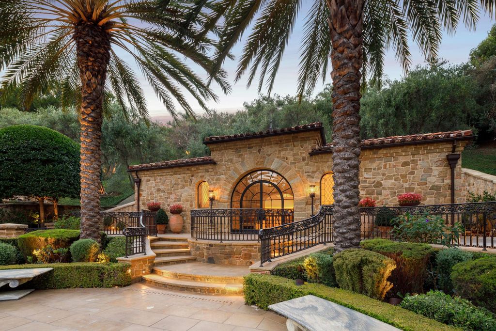 38 Beverly Park Circle Home in Beverly Hills, California. Explore the enchanting Tuscan Villa in the prestigious guard-gated enclave of Beverly Park. This Robert Sinclair masterpiece offers 5 bedrooms, 11 bathrooms, and a host of luxurious features. Nestled on nearly 3 acres, the property boasts mature trees, fountains, and serene walkways.