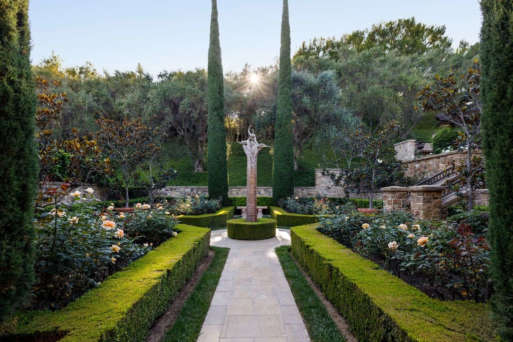 38 Beverly Park Circle Home in Beverly Hills, California. Explore the enchanting Tuscan Villa in the prestigious guard-gated enclave of Beverly Park. This Robert Sinclair masterpiece offers 5 bedrooms, 11 bathrooms, and a host of luxurious features. Nestled on nearly 3 acres, the property boasts mature trees, fountains, and serene walkways.