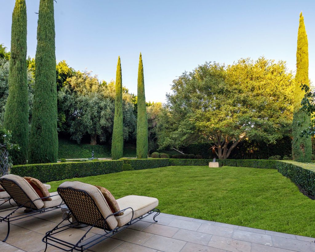 38 Beverly Park Circle Home in Beverly Hills, California. Explore the enchanting Tuscan Villa in the prestigious guard-gated enclave of Beverly Park. This Robert Sinclair masterpiece offers 5 bedrooms, 11 bathrooms, and a host of luxurious features. Nestled on nearly 3 acres, the property boasts mature trees, fountains, and serene walkways.