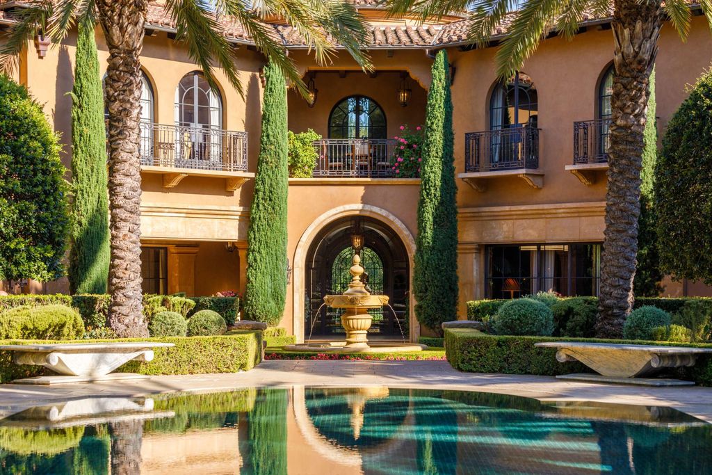 38 Beverly Park Circle Home in Beverly Hills, California. Explore the enchanting Tuscan Villa in the prestigious guard-gated enclave of Beverly Park. This Robert Sinclair masterpiece offers 5 bedrooms, 11 bathrooms, and a host of luxurious features. Nestled on nearly 3 acres, the property boasts mature trees, fountains, and serene walkways.