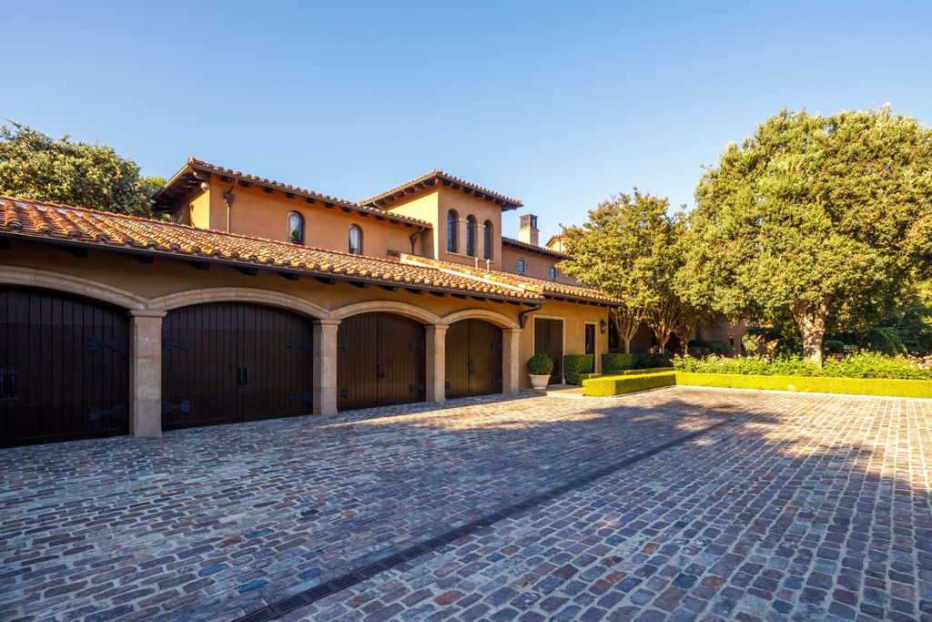 38 Beverly Park Circle Home in Beverly Hills, California. Explore the enchanting Tuscan Villa in the prestigious guard-gated enclave of Beverly Park. This Robert Sinclair masterpiece offers 5 bedrooms, 11 bathrooms, and a host of luxurious features. Nestled on nearly 3 acres, the property boasts mature trees, fountains, and serene walkways.