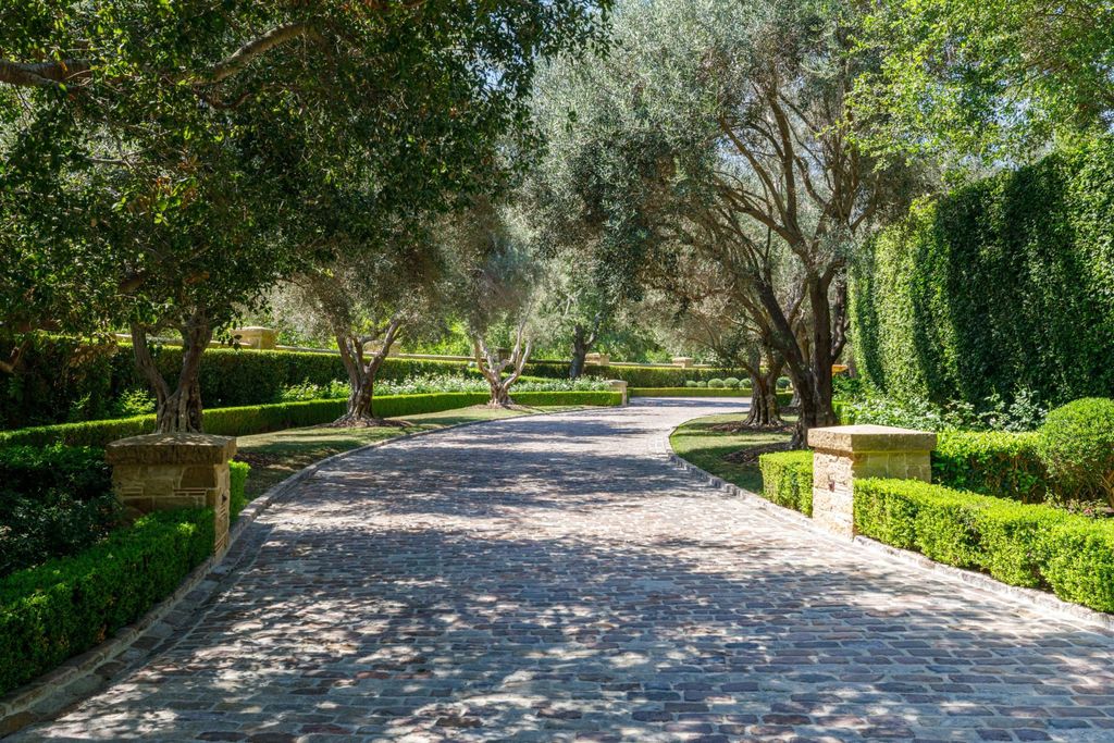 38 Beverly Park Circle Home in Beverly Hills, California. Explore the enchanting Tuscan Villa in the prestigious guard-gated enclave of Beverly Park. This Robert Sinclair masterpiece offers 5 bedrooms, 11 bathrooms, and a host of luxurious features. Nestled on nearly 3 acres, the property boasts mature trees, fountains, and serene walkways.
