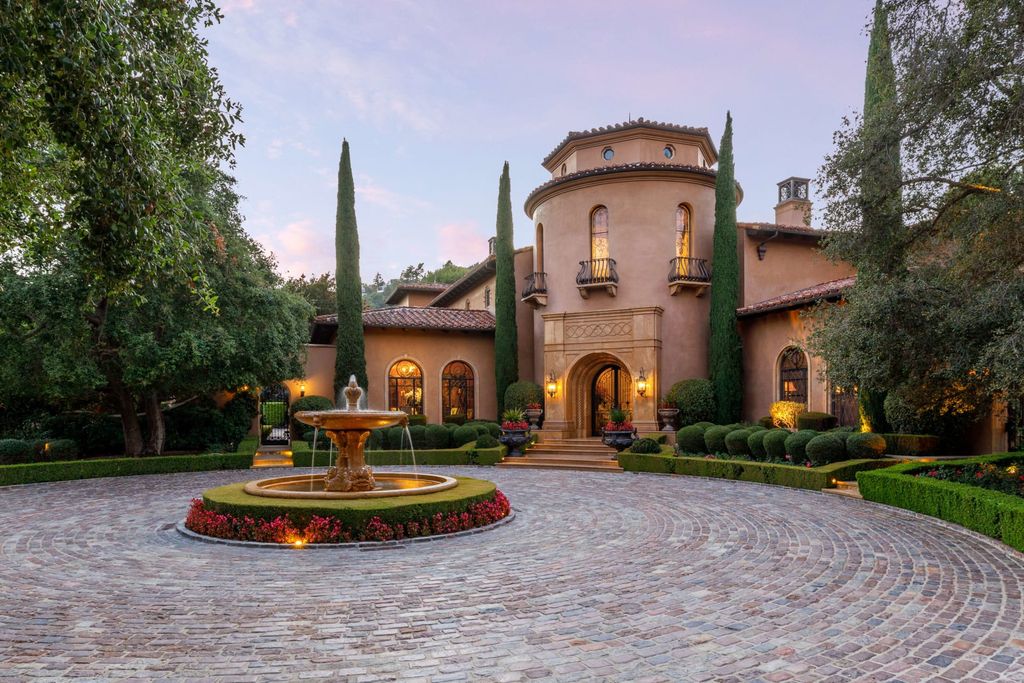 38 Beverly Park Circle Home in Beverly Hills, California. Explore the enchanting Tuscan Villa in the prestigious guard-gated enclave of Beverly Park. This Robert Sinclair masterpiece offers 5 bedrooms, 11 bathrooms, and a host of luxurious features. Nestled on nearly 3 acres, the property boasts mature trees, fountains, and serene walkways.
