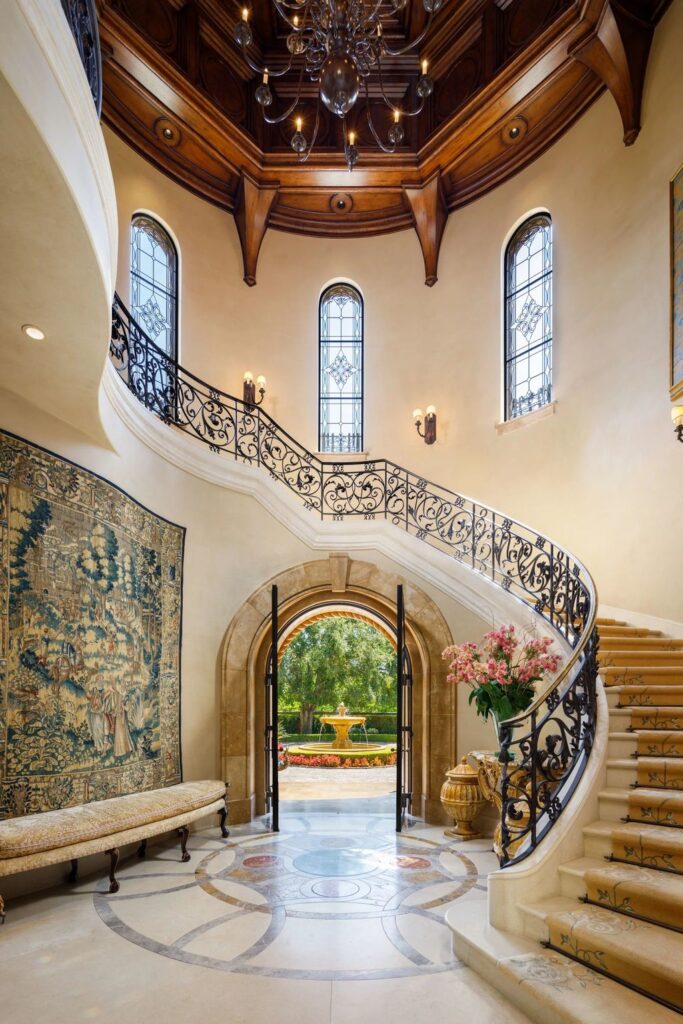 38 Beverly Park Circle Home in Beverly Hills, California. Explore the enchanting Tuscan Villa in the prestigious guard-gated enclave of Beverly Park. This Robert Sinclair masterpiece offers 5 bedrooms, 11 bathrooms, and a host of luxurious features. Nestled on nearly 3 acres, the property boasts mature trees, fountains, and serene walkways.