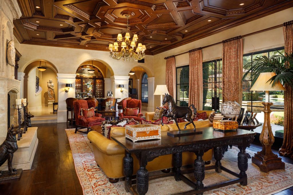 38 Beverly Park Circle Home in Beverly Hills, California. Explore the enchanting Tuscan Villa in the prestigious guard-gated enclave of Beverly Park. This Robert Sinclair masterpiece offers 5 bedrooms, 11 bathrooms, and a host of luxurious features. Nestled on nearly 3 acres, the property boasts mature trees, fountains, and serene walkways.
