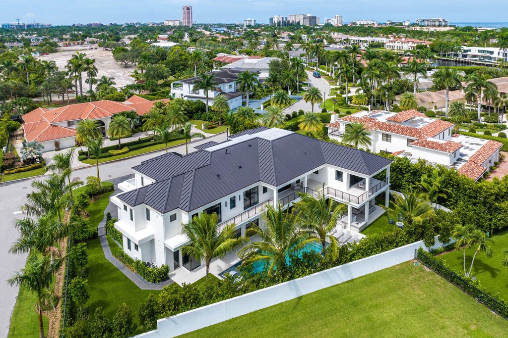 484 Royal Palm Way Home in Boca Raton, Florida. Discover the pinnacle of opulence in Boca Raton with this stunning Signature Estate by SRD Building Corp. Located in the prestigious Royal Palm Yacht & Country Club, this exquisite property offers six bedroom suites, 7 full and 2 half bathrooms, and unparalleled features like a Crestron smart-home system.