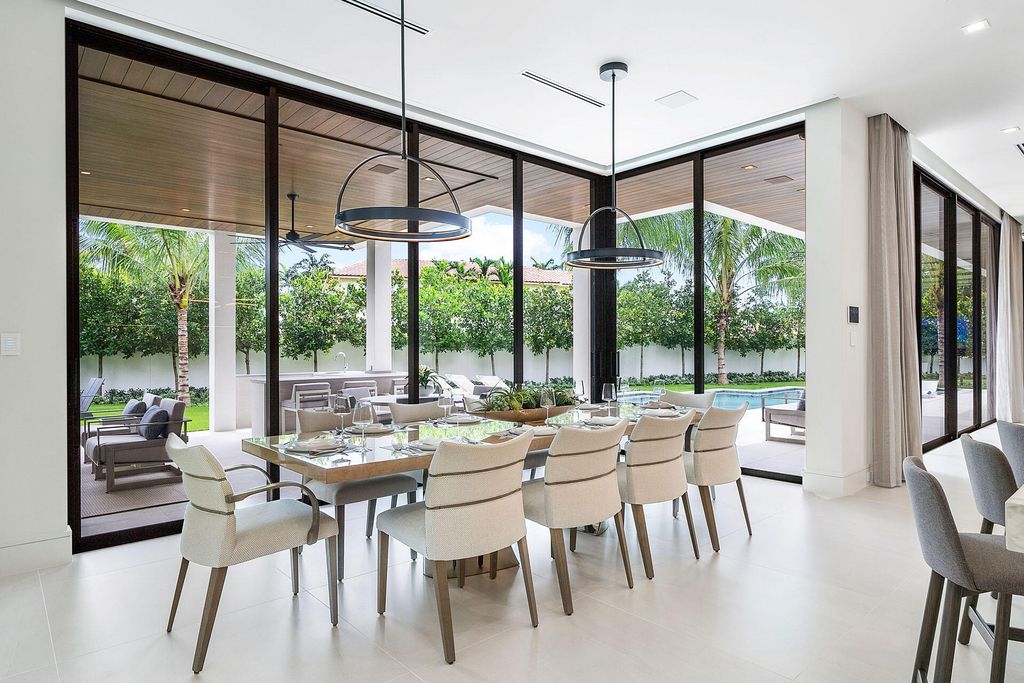 484 Royal Palm Way Home in Boca Raton, Florida. Discover the pinnacle of opulence in Boca Raton with this stunning Signature Estate by SRD Building Corp. Located in the prestigious Royal Palm Yacht & Country Club, this exquisite property offers six bedroom suites, 7 full and 2 half bathrooms, and unparalleled features like a Crestron smart-home system.