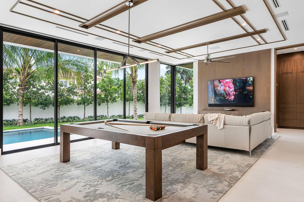 484 Royal Palm Way Home in Boca Raton, Florida. Discover the pinnacle of opulence in Boca Raton with this stunning Signature Estate by SRD Building Corp. Located in the prestigious Royal Palm Yacht & Country Club, this exquisite property offers six bedroom suites, 7 full and 2 half bathrooms, and unparalleled features like a Crestron smart-home system.