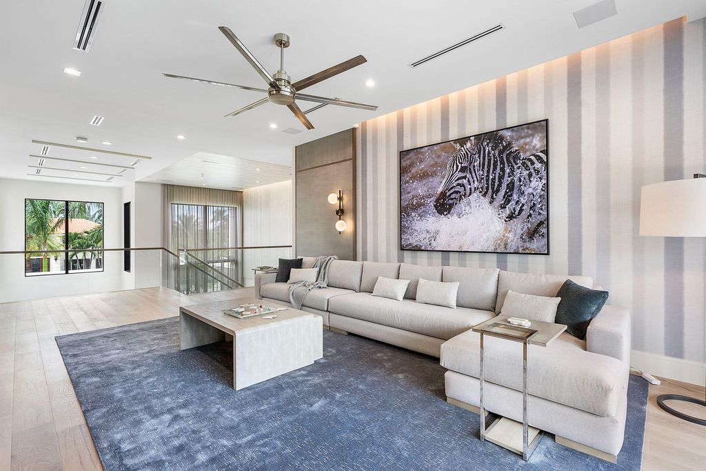 484 Royal Palm Way Home in Boca Raton, Florida. Discover the pinnacle of opulence in Boca Raton with this stunning Signature Estate by SRD Building Corp. Located in the prestigious Royal Palm Yacht & Country Club, this exquisite property offers six bedroom suites, 7 full and 2 half bathrooms, and unparalleled features like a Crestron smart-home system.