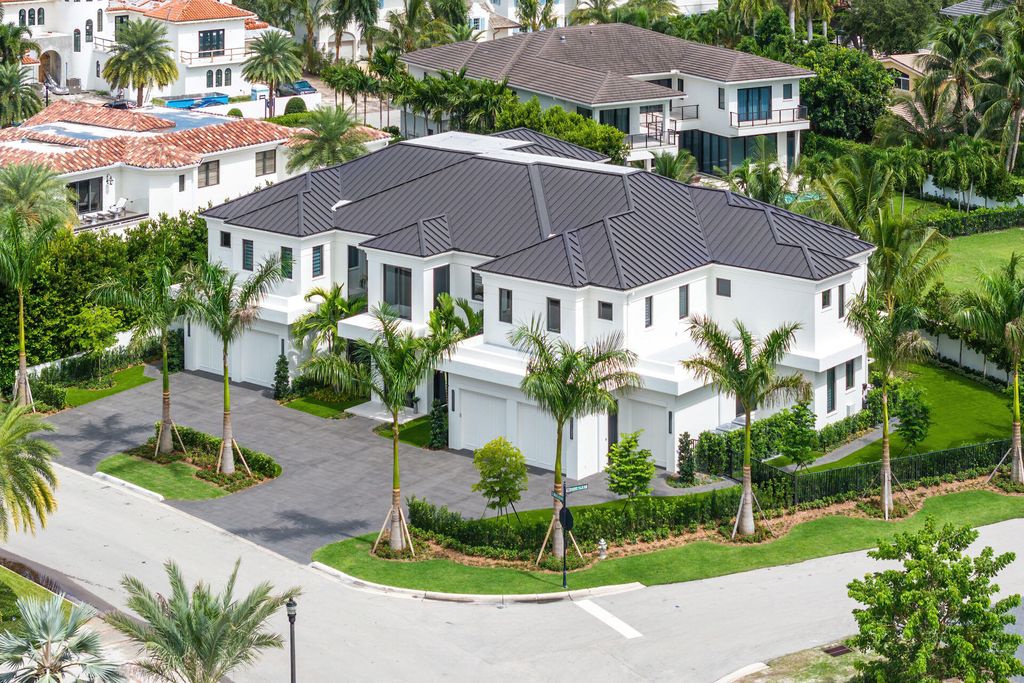 484 Royal Palm Way Home in Boca Raton, Florida. Discover the pinnacle of opulence in Boca Raton with this stunning Signature Estate by SRD Building Corp. Located in the prestigious Royal Palm Yacht & Country Club, this exquisite property offers six bedroom suites, 7 full and 2 half bathrooms, and unparalleled features like a Crestron smart-home system.