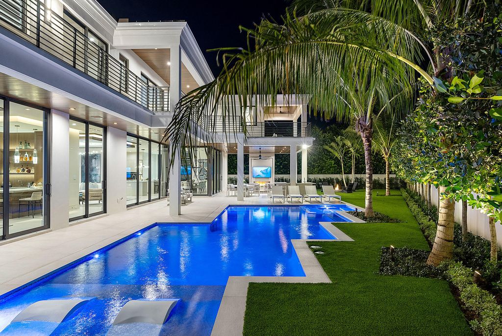 484 Royal Palm Way Home in Boca Raton, Florida. Discover the pinnacle of opulence in Boca Raton with this stunning Signature Estate by SRD Building Corp. Located in the prestigious Royal Palm Yacht & Country Club, this exquisite property offers six bedroom suites, 7 full and 2 half bathrooms, and unparalleled features like a Crestron smart-home system.