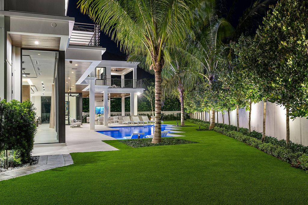 484 Royal Palm Way Home in Boca Raton, Florida. Discover the pinnacle of opulence in Boca Raton with this stunning Signature Estate by SRD Building Corp. Located in the prestigious Royal Palm Yacht & Country Club, this exquisite property offers six bedroom suites, 7 full and 2 half bathrooms, and unparalleled features like a Crestron smart-home system.