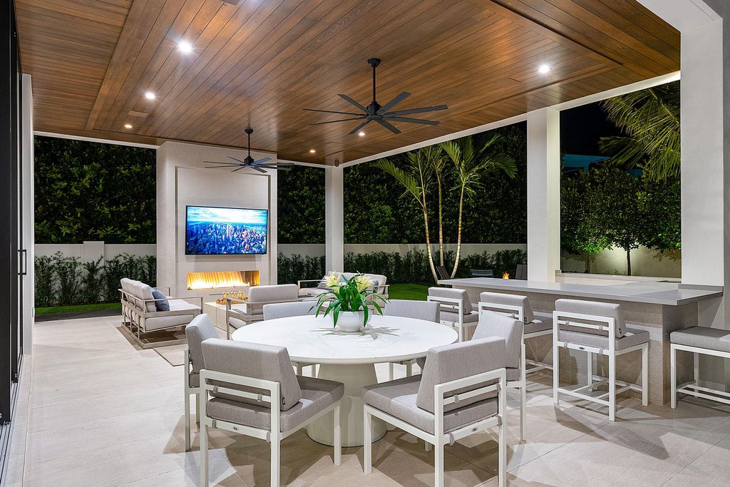 484 Royal Palm Way Home in Boca Raton, Florida. Discover the pinnacle of opulence in Boca Raton with this stunning Signature Estate by SRD Building Corp. Located in the prestigious Royal Palm Yacht & Country Club, this exquisite property offers six bedroom suites, 7 full and 2 half bathrooms, and unparalleled features like a Crestron smart-home system.