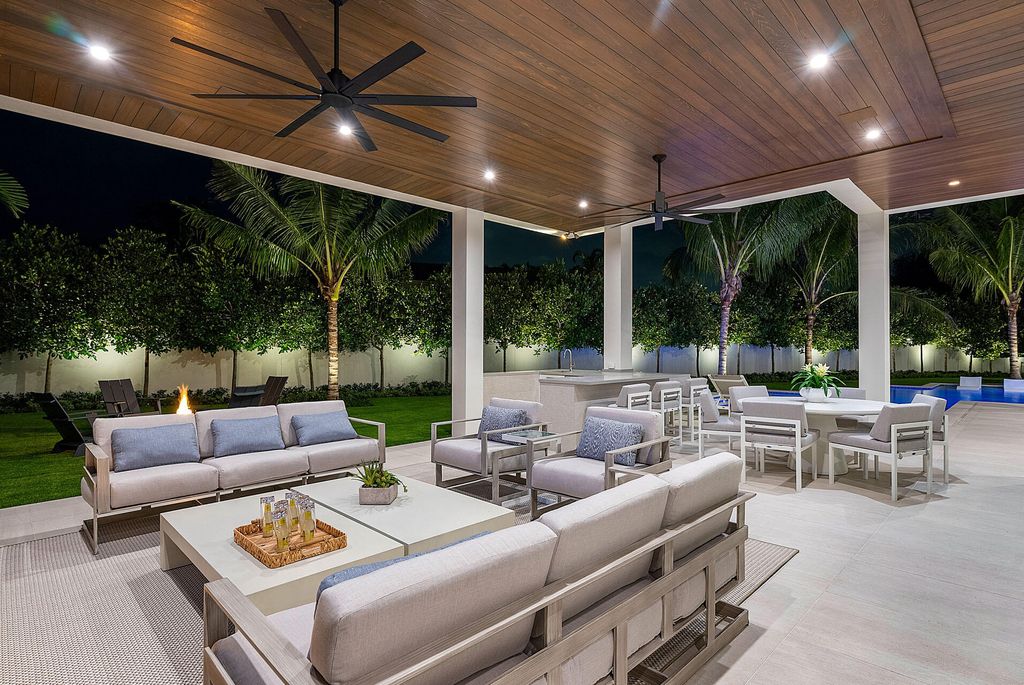 484 Royal Palm Way Home in Boca Raton, Florida. Discover the pinnacle of opulence in Boca Raton with this stunning Signature Estate by SRD Building Corp. Located in the prestigious Royal Palm Yacht & Country Club, this exquisite property offers six bedroom suites, 7 full and 2 half bathrooms, and unparalleled features like a Crestron smart-home system.