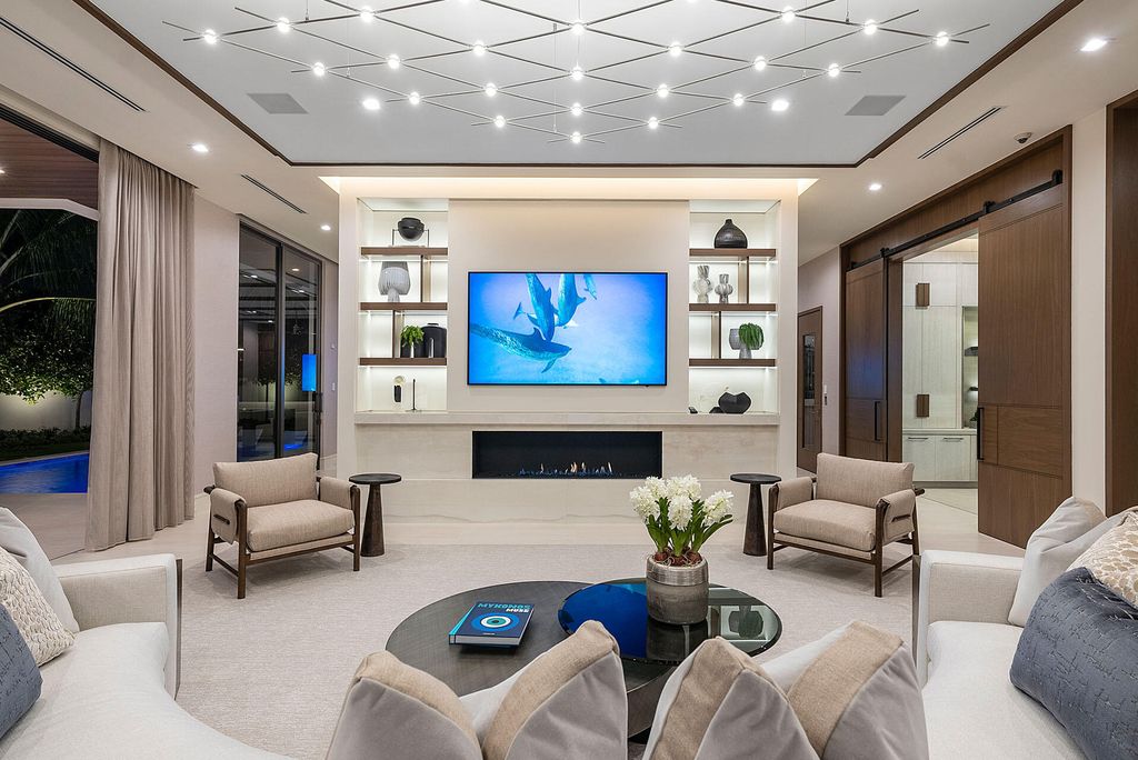 484 Royal Palm Way Home in Boca Raton, Florida. Discover the pinnacle of opulence in Boca Raton with this stunning Signature Estate by SRD Building Corp. Located in the prestigious Royal Palm Yacht & Country Club, this exquisite property offers six bedroom suites, 7 full and 2 half bathrooms, and unparalleled features like a Crestron smart-home system.