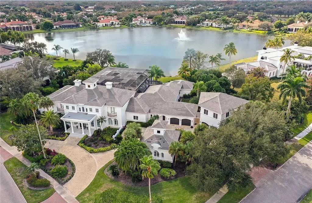 Welcome to Sunspray Estate, an exquisite 5-bedroom masterpiece nestled along the shores of a secluded spring-fed lake in Naples, Florida.