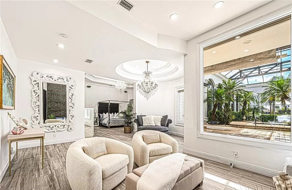 Welcome to Sunspray Estate, an exquisite 5-bedroom masterpiece nestled along the shores of a secluded spring-fed lake in Naples, Florida.