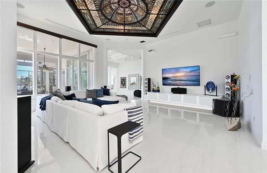 Welcome to Sunspray Estate, an exquisite 5-bedroom masterpiece nestled along the shores of a secluded spring-fed lake in Naples, Florida.