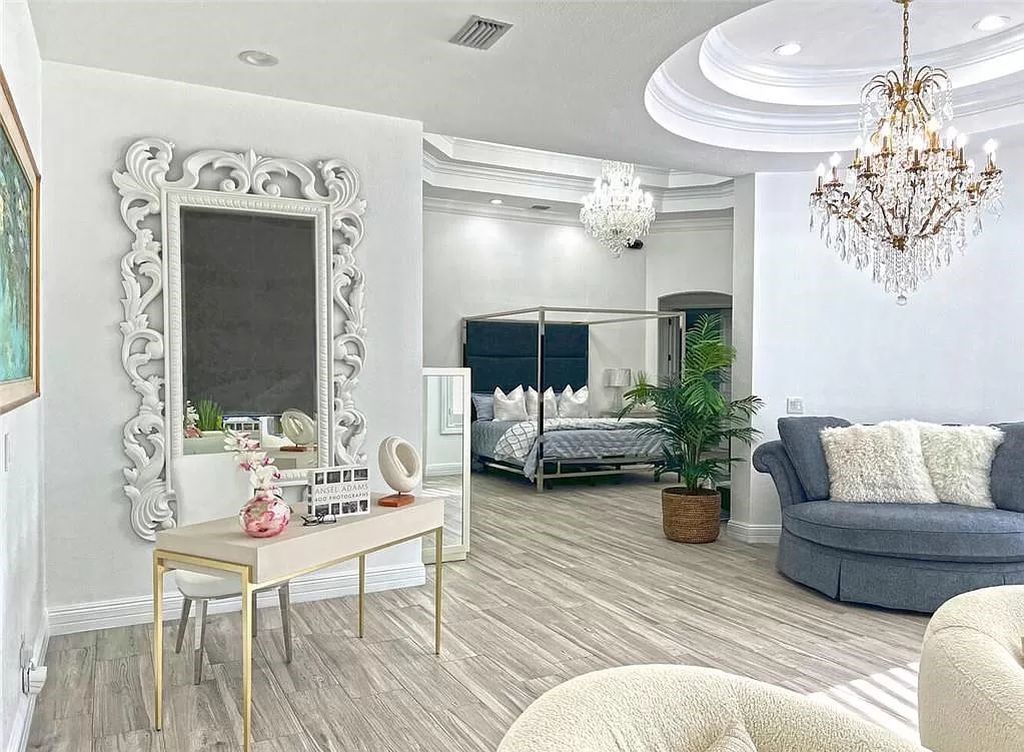 Welcome to Sunspray Estate, an exquisite 5-bedroom masterpiece nestled along the shores of a secluded spring-fed lake in Naples, Florida.