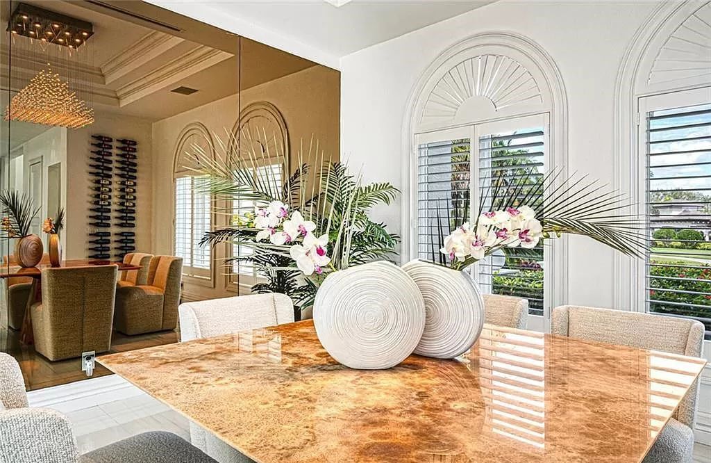 Welcome to Sunspray Estate, an exquisite 5-bedroom masterpiece nestled along the shores of a secluded spring-fed lake in Naples, Florida.