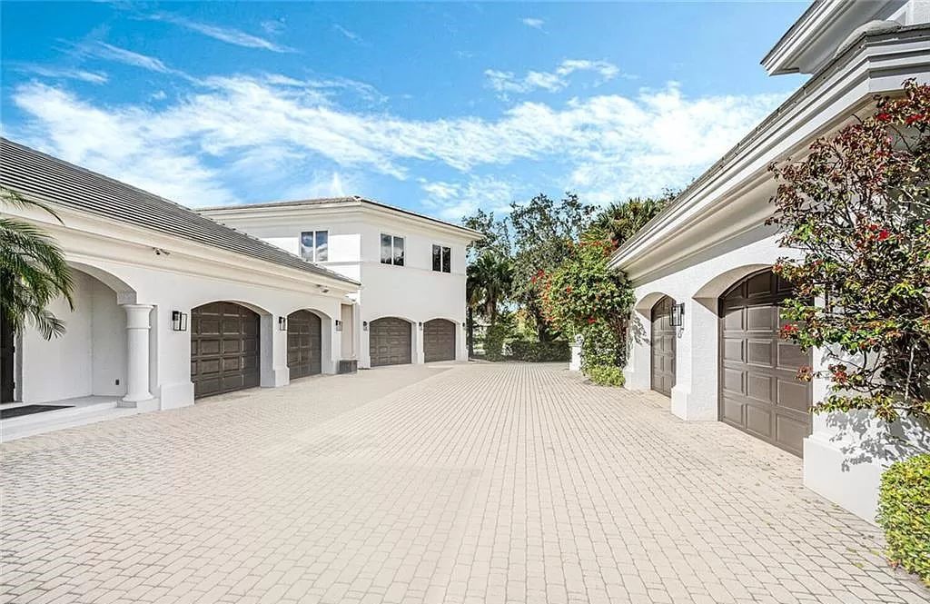 Welcome to Sunspray Estate, an exquisite 5-bedroom masterpiece nestled along the shores of a secluded spring-fed lake in Naples, Florida.