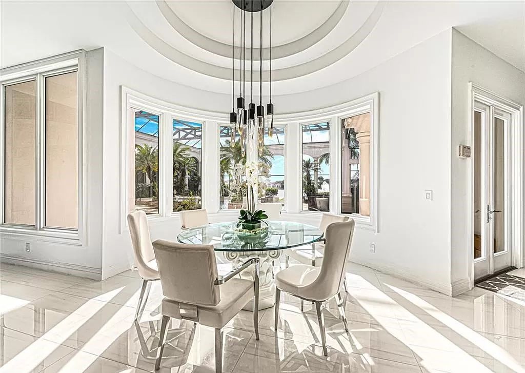 Welcome to Sunspray Estate, an exquisite 5-bedroom masterpiece nestled along the shores of a secluded spring-fed lake in Naples, Florida.